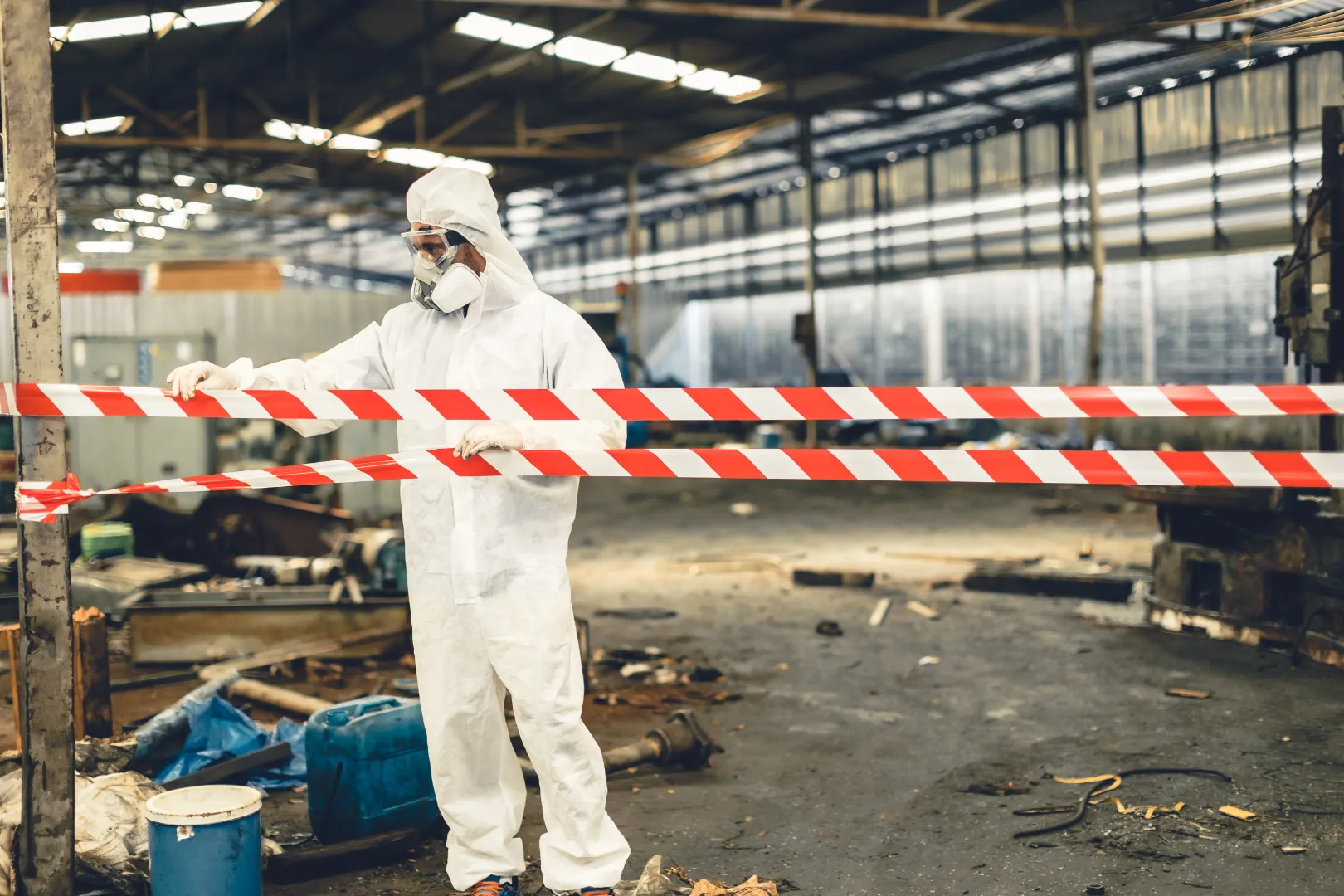 Hazardous material cleanup area in a warehouse blocked off with safety barrier tape
