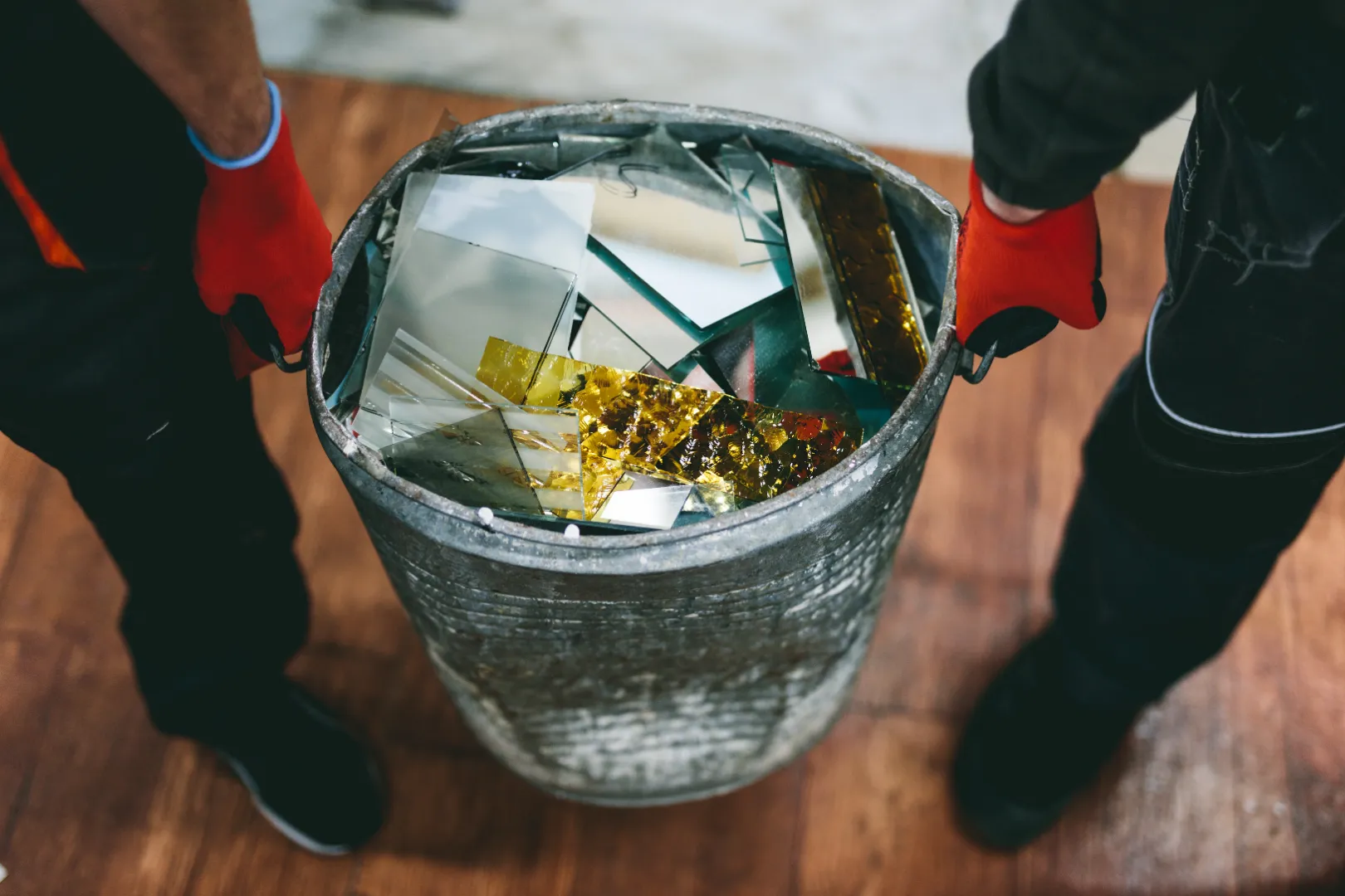 Workers removing waste and debris from an industrial facility